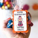 Hand holding Gumball Valentine treat with personalized tag
