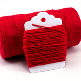 Thin red, solid baker's twine wrapped around a white cardstock tag